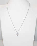 Collana croce con punti luce