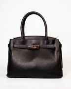 Borsa a mano elegante con dettaglio dorato